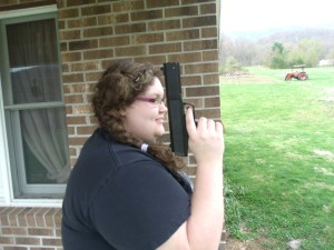 Girl and gun!  Look out!