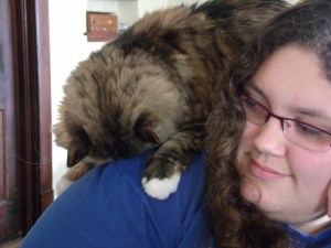 She demands attention.  Her meow is adorable, and her fur is softer than a cloud.